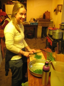 Chopping scallions in the kitchen, muy bien.